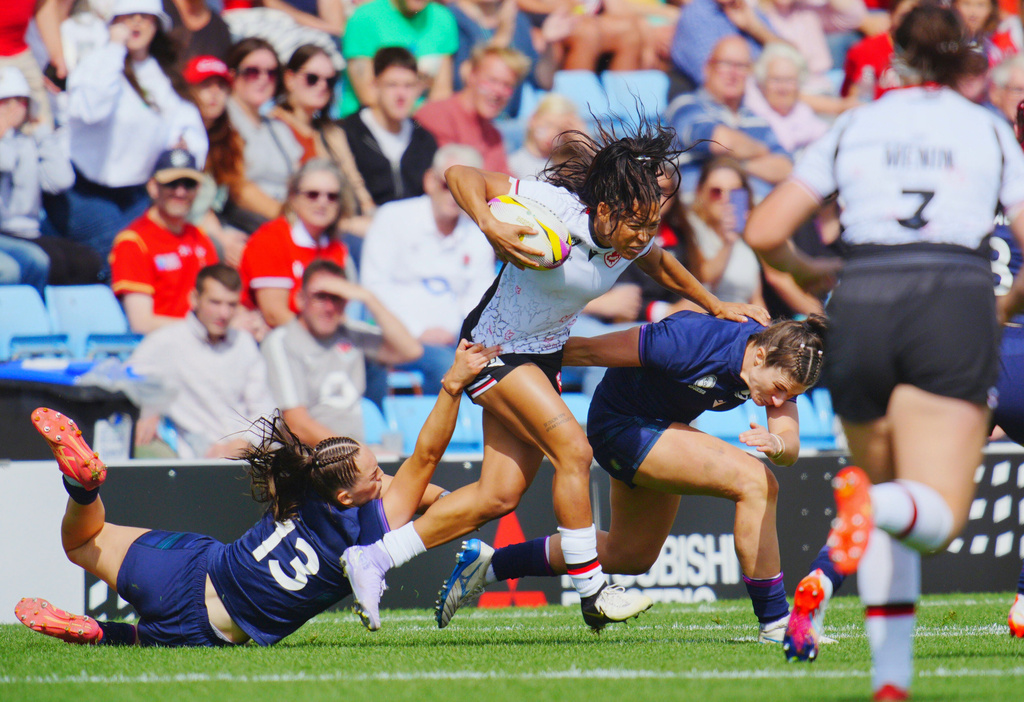 Canada's Asia Hogan-Rochester, center, in action during the Women's Rugby World Cup 2025 Pool B match between Scotland and Canada, at Sandy Park, in Exeter, England, Saturday, Sept. 6, 2025. (Ben Birchall/PA via AP)