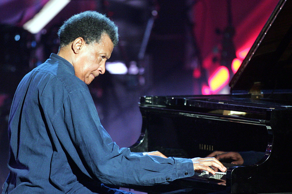 FILE - Musician Abdullah Ibrahim plays on a grand piano during the Adolf-Grimme awards gala in Marl, western Germany, March 18, 2005. (AP Photo/Martin Meissner, File)