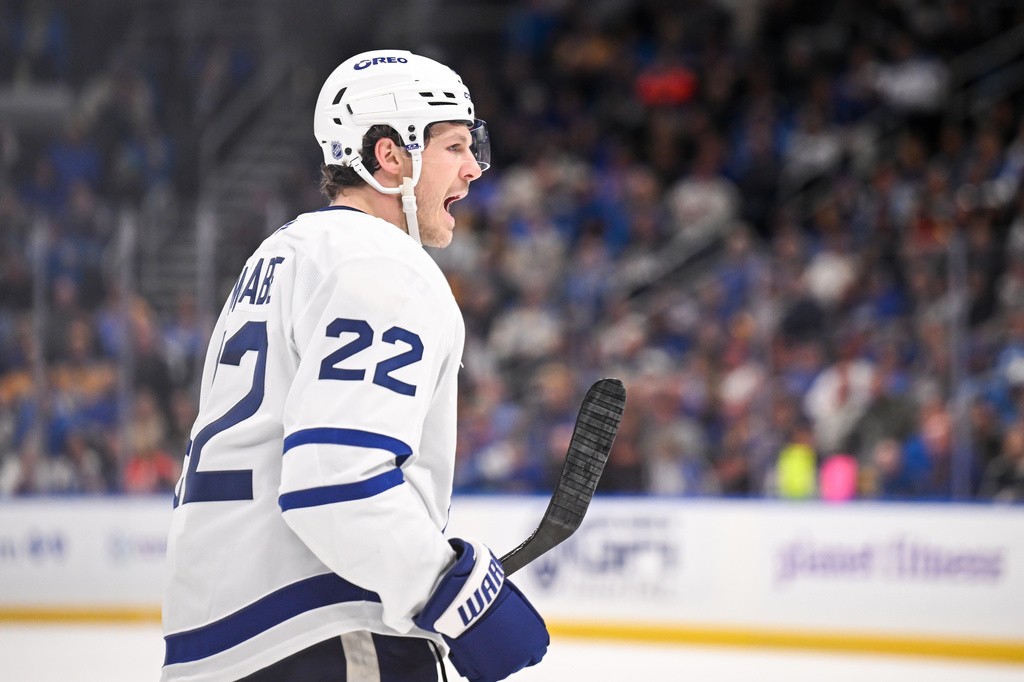 Toronto Maple Leafs' Jake McCabe (22) reacts after scoring a goal during the third period of an NHL hockey game against the St. Louis Blues' Saturday, March 28, 2026, in St. Louis. (AP Photo/Connor Hamilton)