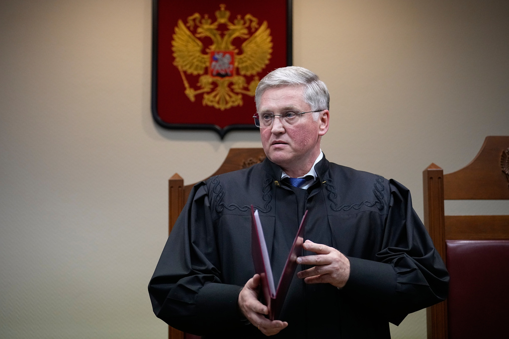 Court judge Vyacheslav Kirillov reads a ruling to outlaw the "international movement" Memorial as extremist in a move against Nobel Peace Prize-winning rights group in Moscow, Russia, Thursday, April 9, 2026. (AP Photo/Alexander Zemlianichenko)