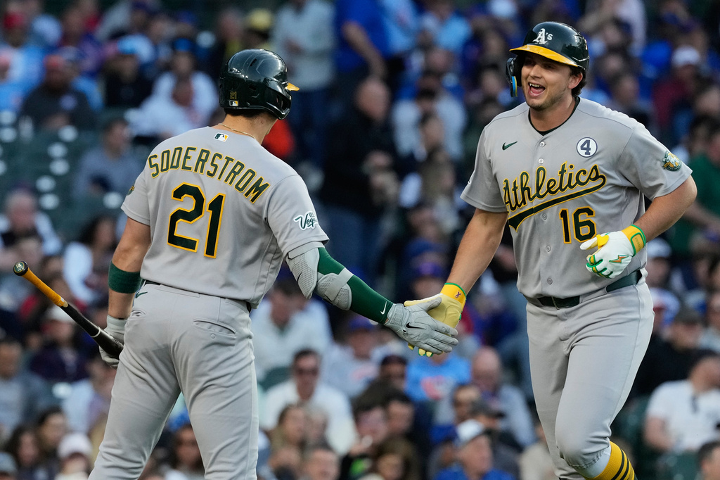 Athletics' Nick Kurtz, right, celebrates with Tyler Soderstrom after hitting a solo home run during the third inning of a baseball game against the Chicago Cubs in Chicago, Tuesday, June 2, 2026. (AP Photo/Nam Y. Huh)