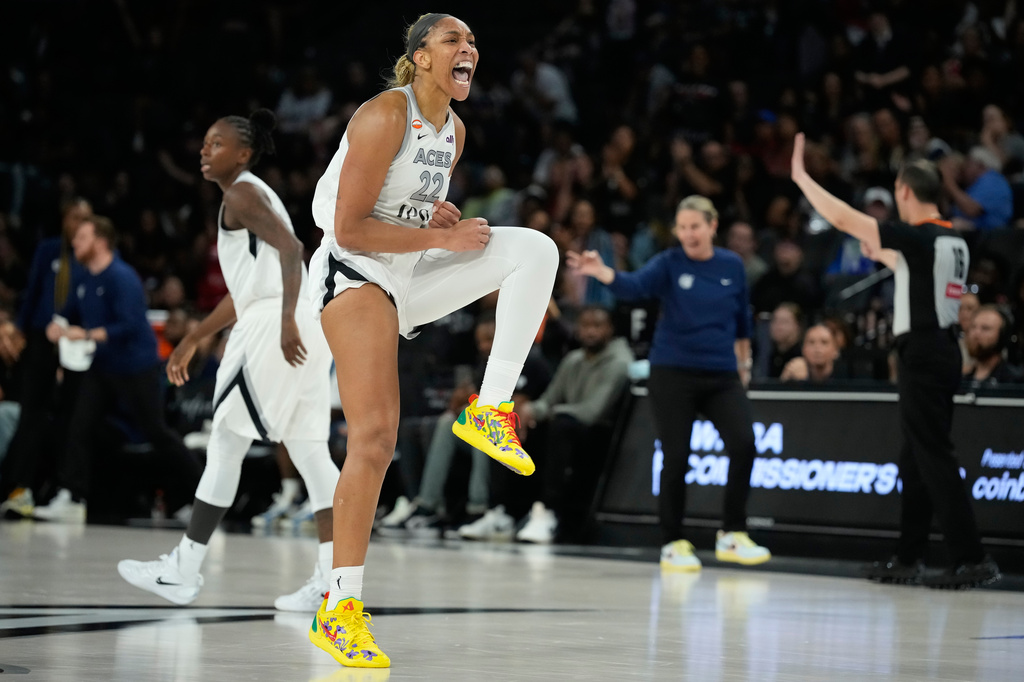 Las Vegas Aces center A'ja Wilson (22) celebrates after a play against the Minnesota Lynx during the second half of a WNBA basketball game Saturday, June 13, 2026, in Las Vegas. (AP Photo/John Locher)