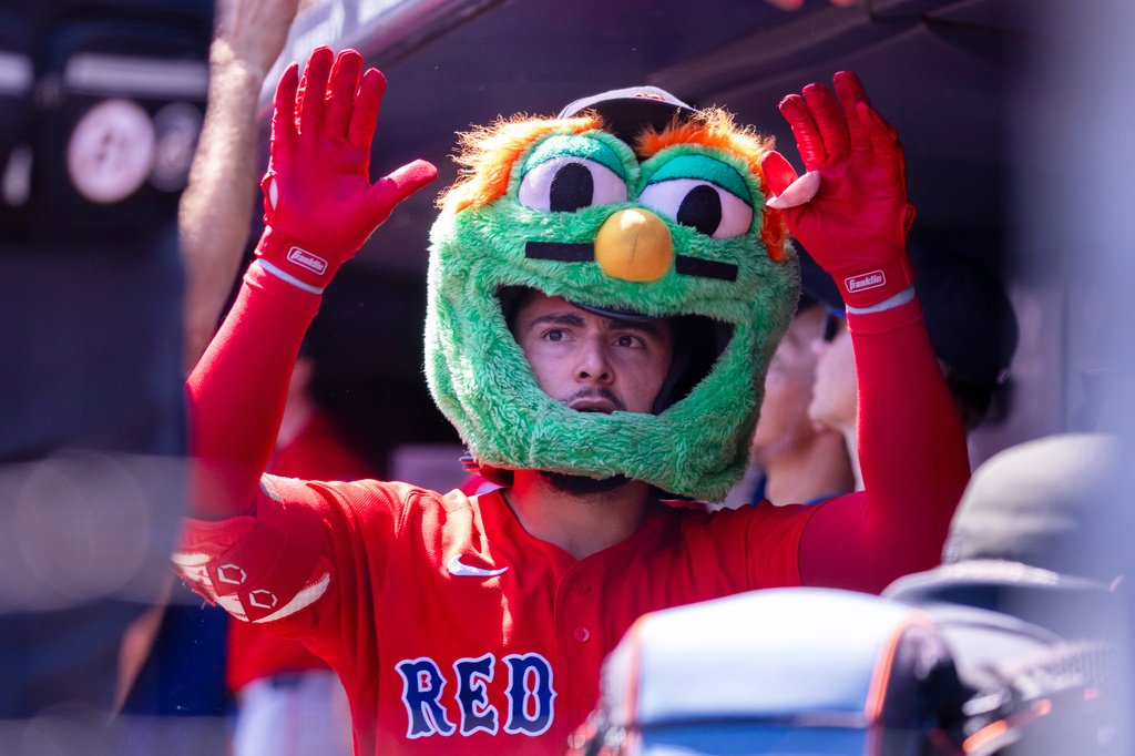 Boston Red Sox' Wilyer Abreu (52) celebrates in the dugout after hitting a solo home run in the first inning during the first baseball game of a doubleheader against the New York Yankees, Saturday, Aug. 29, 2026, in New York. (AP Photo/Corey Sipkin)