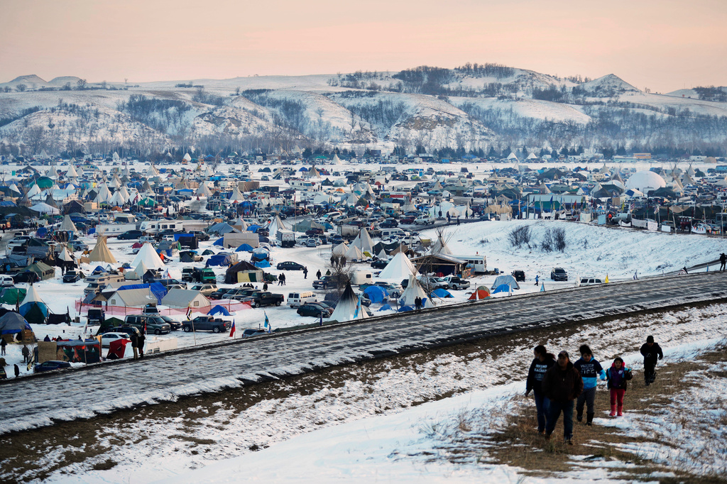 FILE - The Oceti Sakowin camp, where people have gathered to protest the Dakota Access oil pipeline, is seen, Dec. 3, 2016, file photo shows near Cannon Ball, N.D. (AP Photo/David Goldman, File)