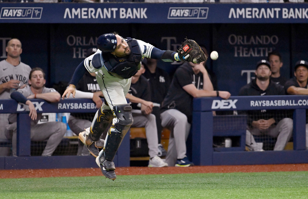 Tampa Bay Rays catcher Nick Fortes just misses catching a foul ball hit by New York Yankees' Jasson Domínguez during the ninth inning of a baseball game Monday, July 6, 2026, in St. Petersburg, Fla. (AP Photo/Jason Behnken)