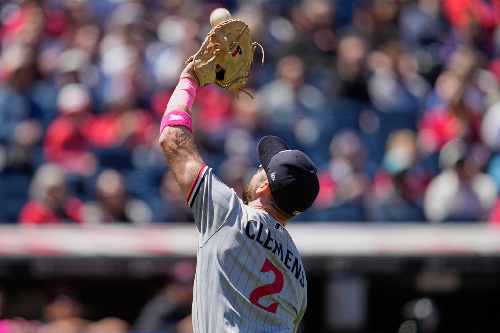 Minnesota Twins first baseman Kody Clemens (2) catches a pop up hit for an out by Cleveland Guardians' Patrick Bailey in the second inning of a baseball game in Cleveland, Sunday, May 10, 2026. (AP Photo/Sue Ogrocki)