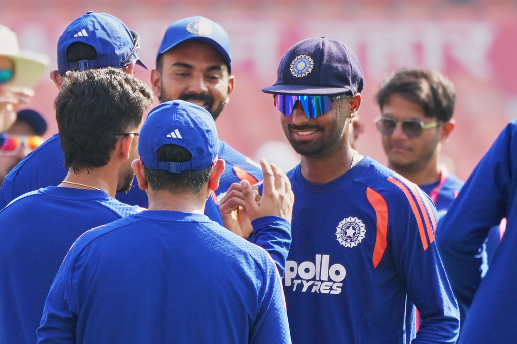 India's Manav Suthar is congratulated by teammates as he makes his test debut before the start of play on day one of the cricket test match between Afghanistan and India in New Chandigarh, India, Saturday, June 6, 2026. (AP Photo/Ashwini Bhatia)