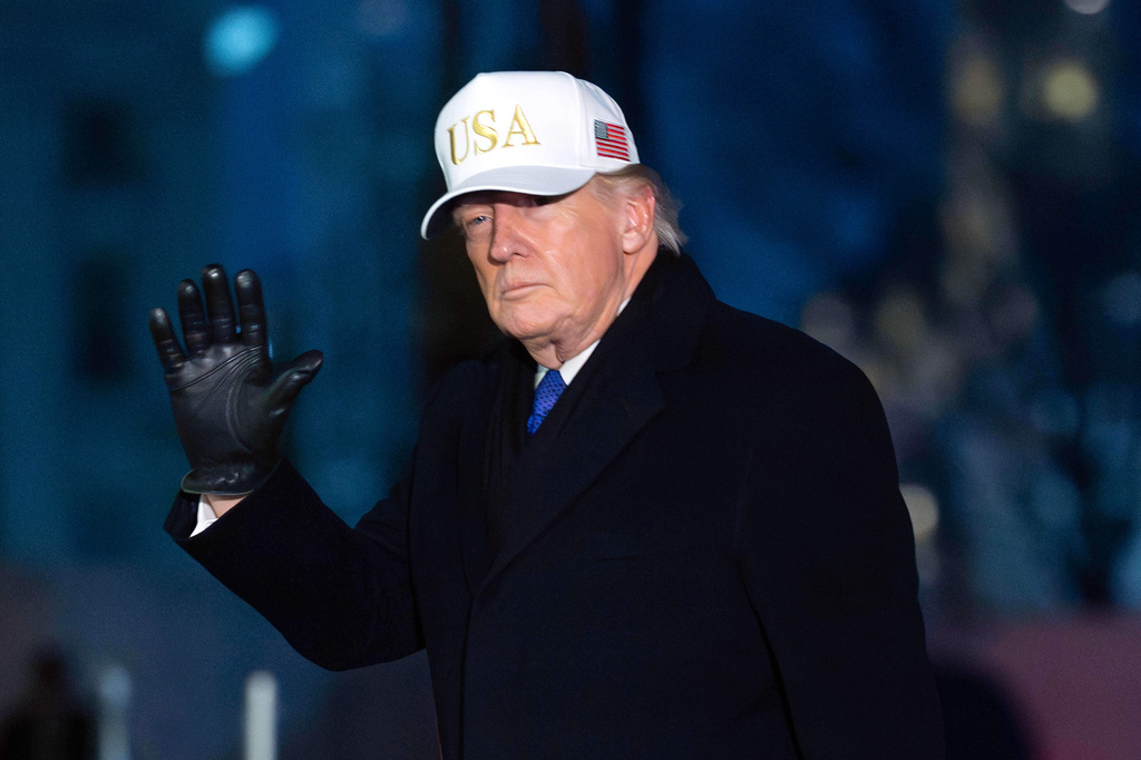 President Donald Trump waves to the media as he walks on the South Lawn of the White House, Sunday, Feb. 1, 2026, in Washington. (AP Photo/Jose Luis Magana)
