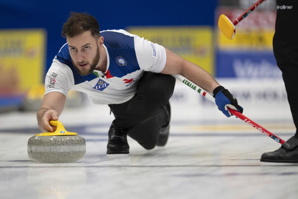 FILE - Italy's Amos Mosaner in action during the bronze medal game against Scotland, of the Men's World Curling Championship, at the IWC Arena in Schaffhausen, Switzerland, Sunday, April 7, 2024. (Christian Beutler/Keystone via AP, File)