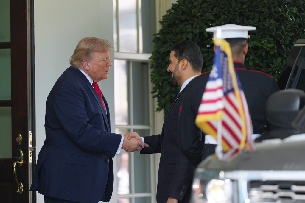President Donald Trump greets Iraq's Prime Minister Ali al-Zaidi at the White House, Tuesday, July 14, 2026, in Washington. (AP Photo/Julia Demaree Nikhinson)