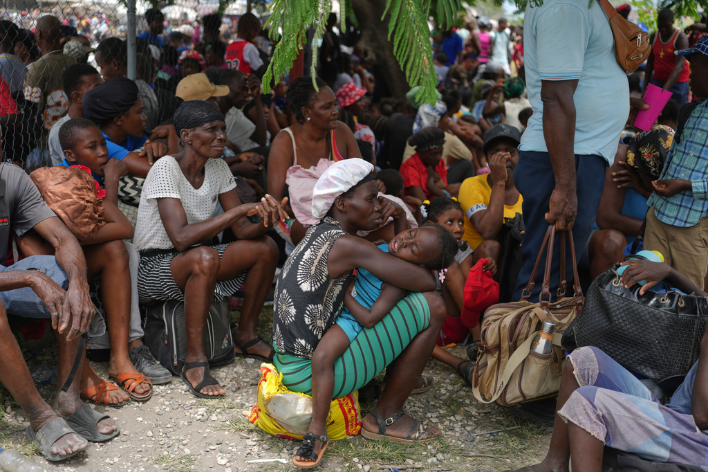 People displaced from their homes due to clashes between armed gangs take refuge at a police station in Port-au-Prince, Haiti, Monday, May 11, 2026. (AP Photo/Odelyn Joseph)