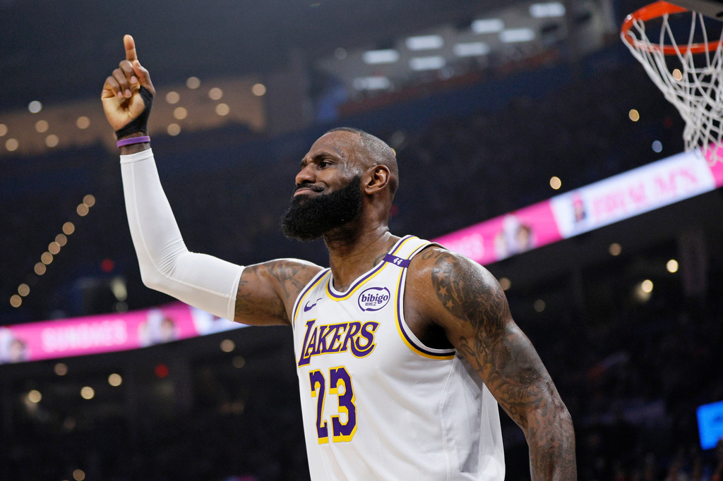 FILE - Los Angeles Lakers forward LeBron James signals that he wants a review of an official's call during the first half of an NBA basketball game against the Oklahoma City Thunder, Sunday, April 6, 2025, in Oklahoma City. (AP Photo/Nate Billings, file)