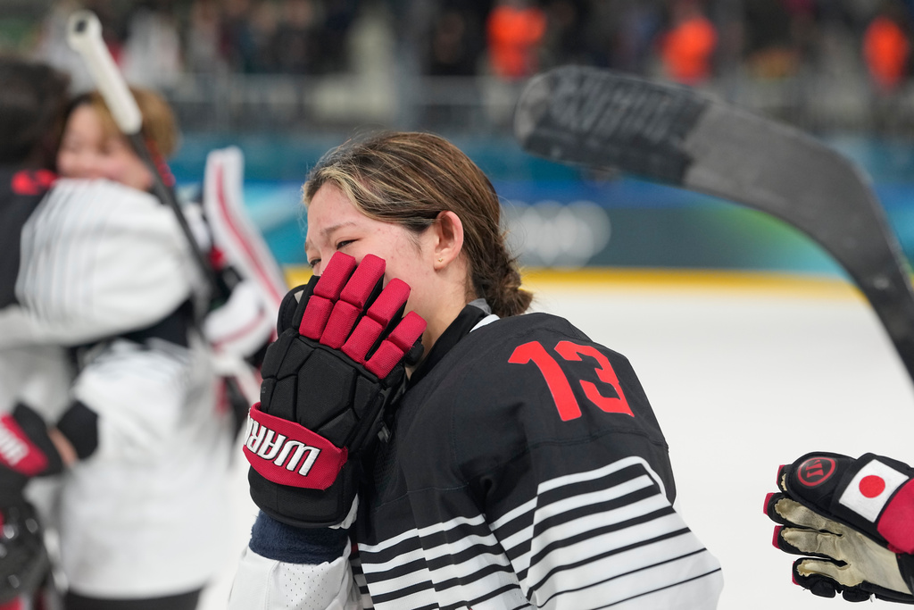 Japan's Yumeka Wajima cries end of a preliminary round match of women's ice hockey between Japan and Sweden at the 2026 Winter Olympics, in Milan, Italy, Tuesday, Feb. 10, 2026. (AP Photo/Hassan Ammar)
