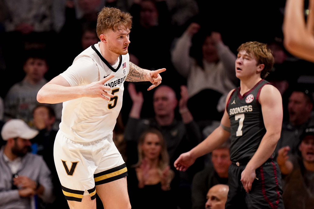 Vanderbilt forward Tyler Nickel (5) celebrates his 3-point shot against Oklahoma during the first half of an NCAA college basketball game Saturday, Feb. 7, 2026, in Nashville, Tenn. (AP Photo/Camden Hall)