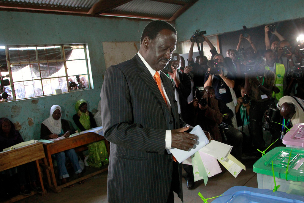 Kenyan Prime Minister and presidential candidate Raila Odinga gets ready to cast his ballot in Nairobi, Kenya Monday, March 4, 2013. (AP Photo/Jerome Delay)