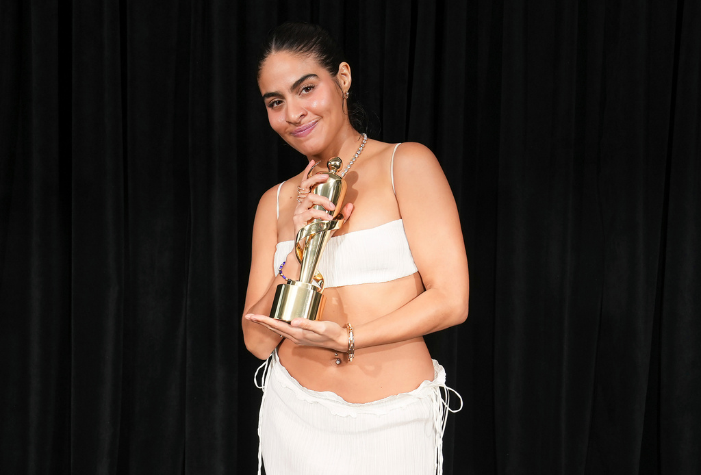 FILE - Jessie Reyez poses for photos after winning Rap Single of the Year award during the Juno Awards in Vancouver, British Columbia on March 30, 2025. (Darryl Dyck/The Canadian Press via AP, File)
