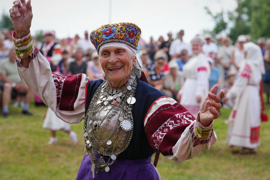 Estonia Seto Kingdom Day A woman wearing traditional Seto costumes dances during the annual Seto Kingdom Day in Mikitamäe, south Estonia, Saturday, Aug. 1, 2026. (AP Photo/Sergei Grits)