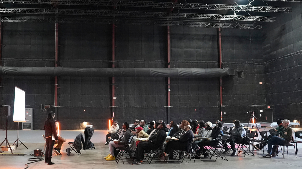 College students listen to a lecture on how to become a production assistant during a Shadowbox Studios tour, Wednesday, Nov. 12, 2025, in Atlanta. (AP Photo/Emilie Megnien)