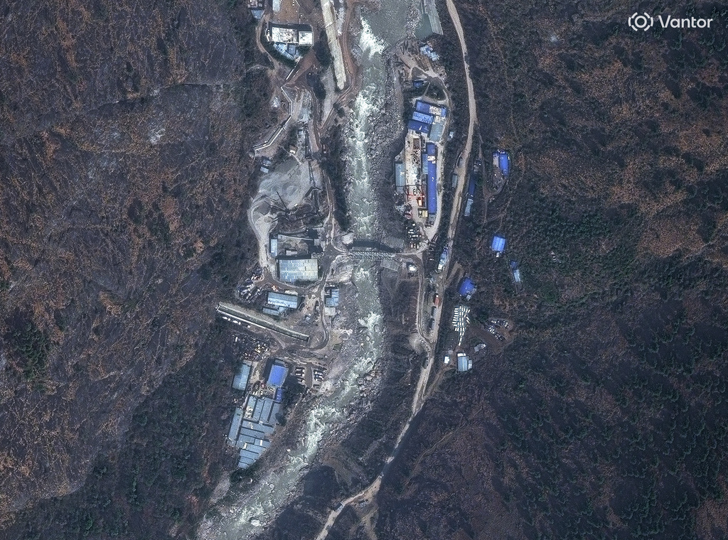 This satellite image provided by Vantor shows a bridge and buildings on the Trishuli River in Nepal on April 19, 2024. (Satellite image ©2026 Vantor via AP)