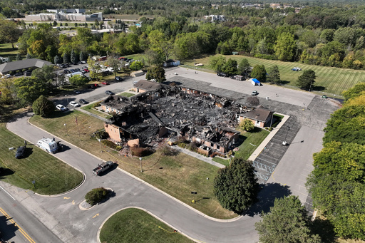 FILE - Little remained of The Church of Jesus Christ of Latter-day Saints chapel the day after a former Marine opened fire and set the building ablaze in Grand Blanc Township, Mich., Monday, Sept. 29, 2025. (AP Photo/Mark Vancleave, File) FILE - Little remained of The Church of Jesus Christ of Latter-day Saints chapel the day after a former Marine opened fire and set the building ablaze in Grand Blanc Township, Mich., Monday, Sept. 29, 2025. (AP Photo/Mark Vancleave, File)