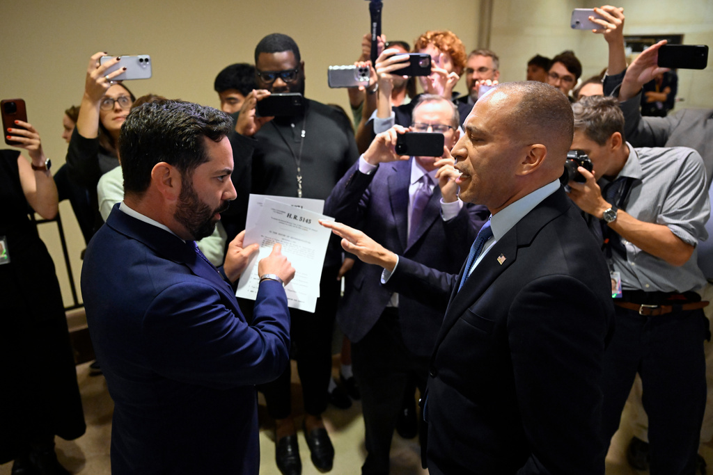 Rep. Michael Lawler, R-N.Y., left, confronts House Minority Leader Hakeem Jeffries, D-N.Y., in a heated discussion to endorse House bill H.R.5145 that would extend the American Rescue Plan Act of 2021 (ARPA) and the Inflation Reduction Act of 2022 at the U.S. Capitol on Wednesday, Oct. 8, 2025, in Washington. (AP Photo/John McDonnell)