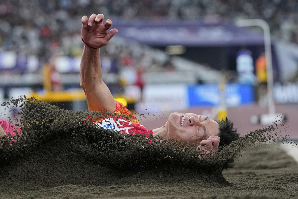 China's Zhang Mingkun competes in the men's long jump final at the World Athletics Championships in Tokyo, Wednesday, Sept. 17, 2025. (AP Photo/Ashley Landis)