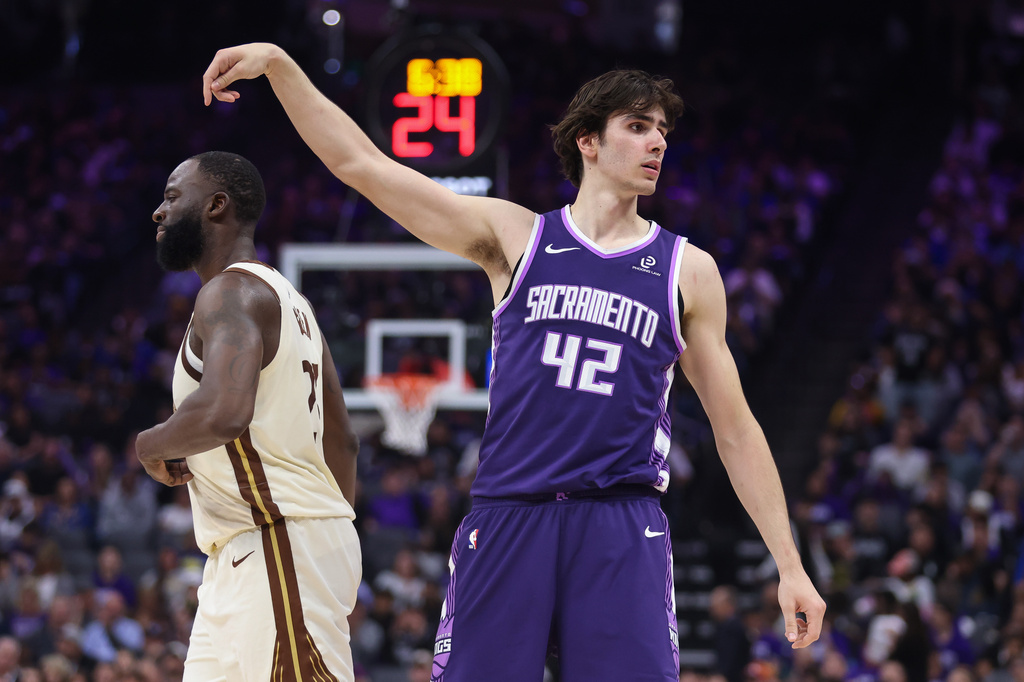 Sacramento Kings center Maxime Raynaud (42) looks into the crowd after making a 3-point basket during the first half of an NBA basketball game against the Golden State Warriors, Friday, April 10, 2026, in Sacramento, Calif. (AP Photo/Scott Marshall)