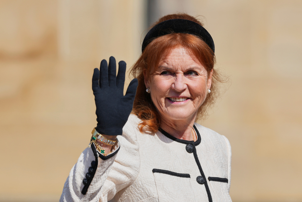 FILE - Sarah Ferguson waves the to the crowd was she attends the Easter Matins Service at St. George's Chapel, Windsor Castle, England, Sunday, April 20, 2025. (AP Photo/Kirsty Wigglesworth, file)