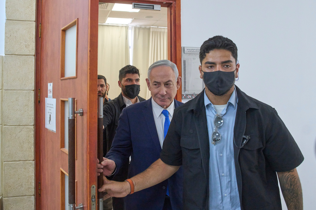 Israeli Prime Minister Benjamin Netanyahu leaves the courtroom after his hearing on corruption charges at the district court in east Jerusalem, Wednesday, July 15, 2026. (AP Photo/Ohad Zwigenberg)