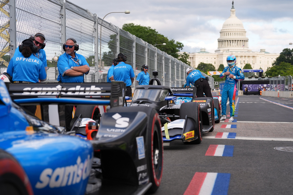 Race car diver Scott McLaughlin gets out of his car after a qualifying race prior to Sunday's Freedom 250 Grand Prix auto race in Washington, Saturday, Aug. 22, 2026.(AP Photo/Alex Brandon)