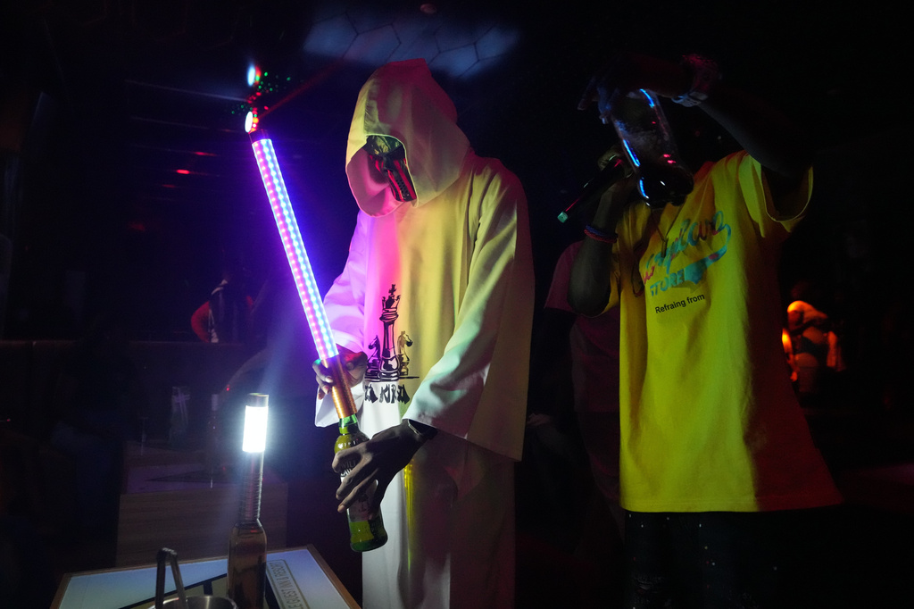 A bartender prepares an alcoholic drink inside a nightclub in Sokoto, Nigeria, July 18, 2026. (AP Photo/Sunday Alamba)