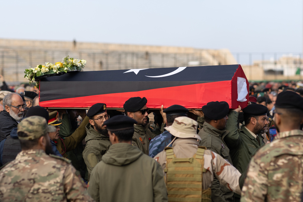 People carry the coffin of Gen. Muhammad Ali Ahmad al-Haddad, in Misrata, Libya, Sunday, Dec. 28, 2025, who was killed with others in a plane crash on Tuesday after taking off from Ankara. (AP Photo/Yousef Murad)