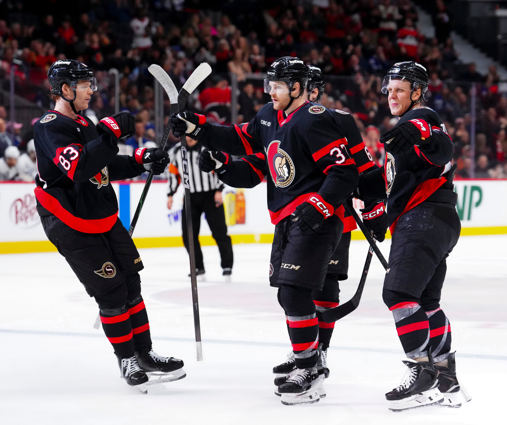 Ottawa Senators' Warren Foegele (37) celebrates his goal with teammates while taking on the Toronto Maple Leafs during the second period of an NHL hockey game in Ottawa, Wednesday, April 15, 2026. (Sean Kilpatrick/The Canadian Press via AP)