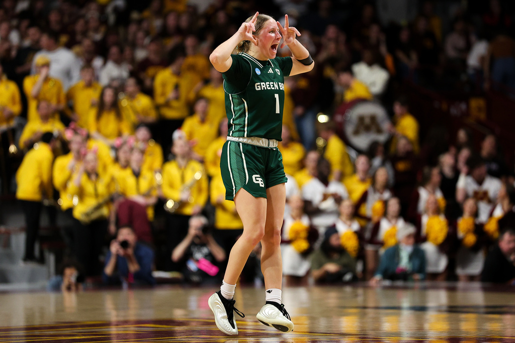 Green Bay guard Kamy Peppler celebrates after a 3-point basket against Minnesota during the first half in the first round of the NCAA college basketball tournament, Friday, March 20, 2026, in Minneapolis. (AP Photo/Matt Krohn)