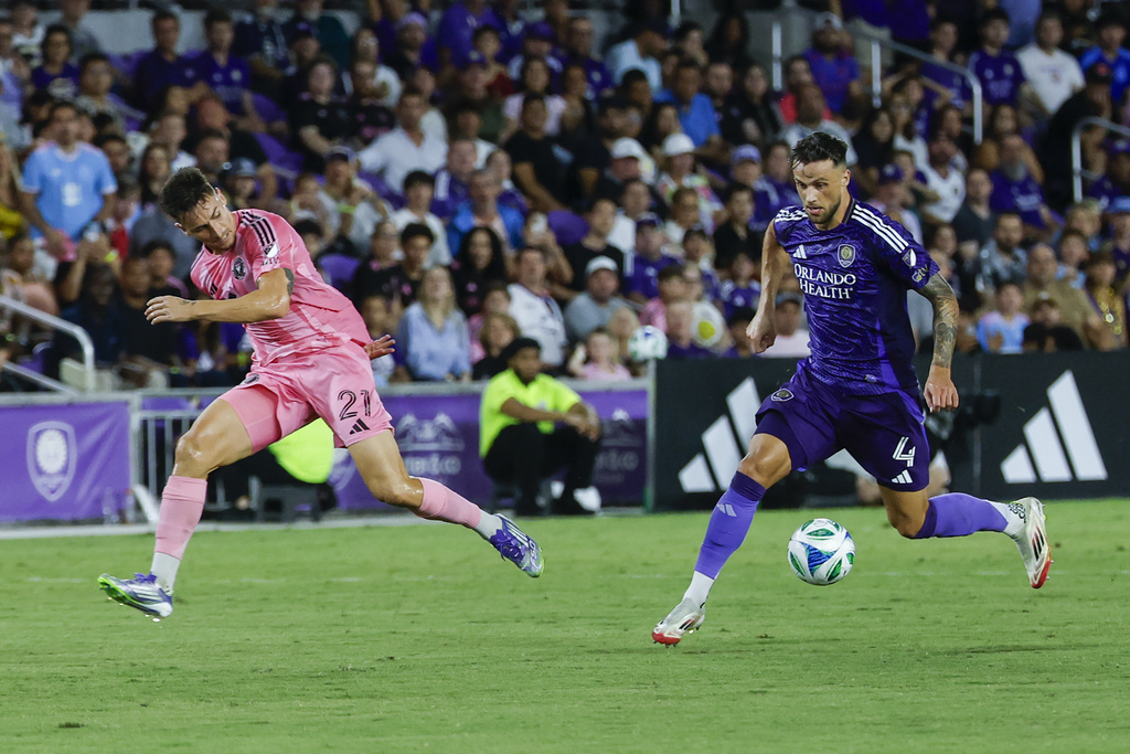 Orlando City defender David Brekalo (4) gets the ball away from Inter Miami forward Tadeo Allende (21) during the first half of an MLS soccer match, Sunday, Aug. 10, 2025, in Orlando, Fla. (AP Photo/Kevin Kolczynski)