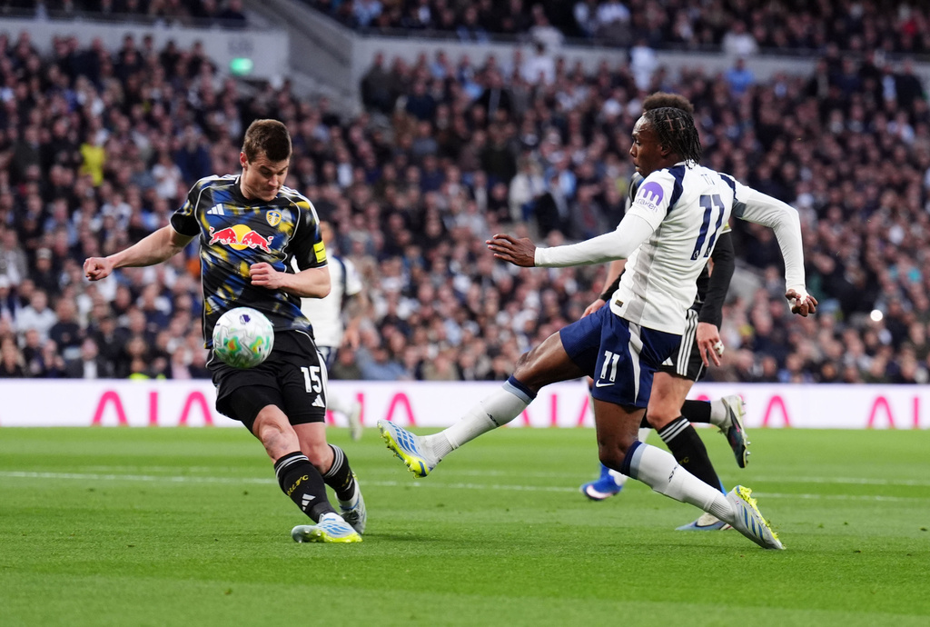 Tottenham Hotspur's Mathys Tel, right, shoots towards goal during the English Premier League soccer match between Tottenham Hotspur and Leeds United in London, Monday May 11, 2026. (John Walton/PA via AP)