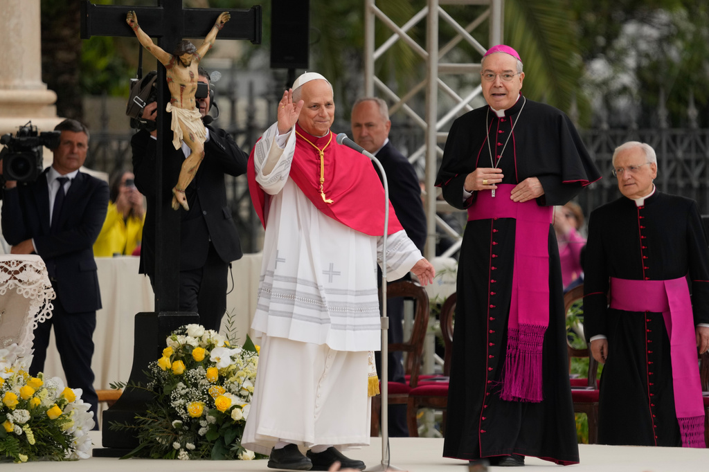 Pope Leo XIV, next to Archbishop Tommaso Caputo, second from right, and Monsignor Leonardo Sapienza, right, greets faithful during his pastoral visit in Pompeii, Italy, Friday, May 8, 2026. (AP Photo/Gregorio Borgia)