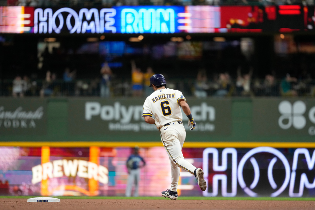 Milwaukee Brewers' David Hamilton rounds the bases after hitting a three-run home run during the sixth inning of a baseball game against the Seattle Mariners, Tuesday, Aug. 18, 2026, in Milwaukee. (AP Photo/Aaron Gash)