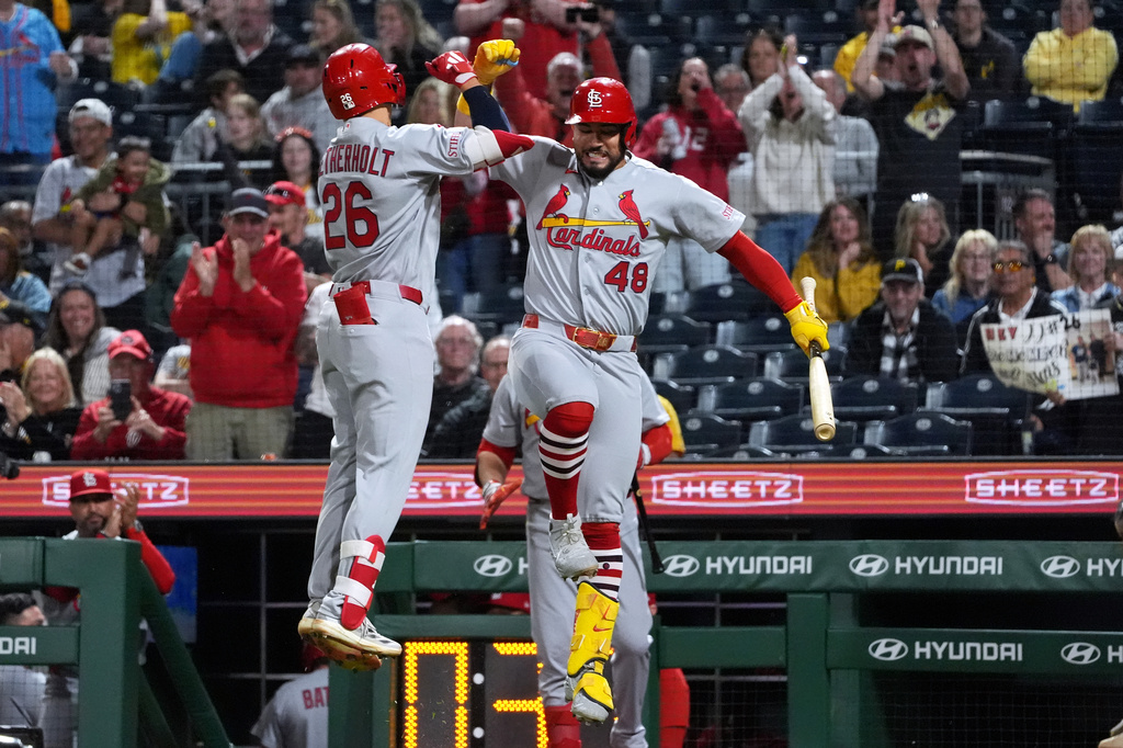 St. Louis Cardinals' JJ Wetherholt (26) celebrates with Iván Herrera (48) on his way back to the dugout after his home run off of Pittsburgh Pirates pitcher Dennis Santana in the ninth inning of a baseball game, in Pittsburgh, Monday, April 27, 2026. (AP Photo/Tom E. Puskar)