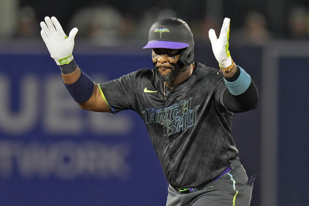 Tampa Bay Rays' Yandy Díaz celebrates after his double off Boston Red Sox pitcher Garrett Crochet during the first inning of a baseball game Friday, Sept. 19, 2025, in Tampa, Fla. (AP Photo/Chris O'Meara)