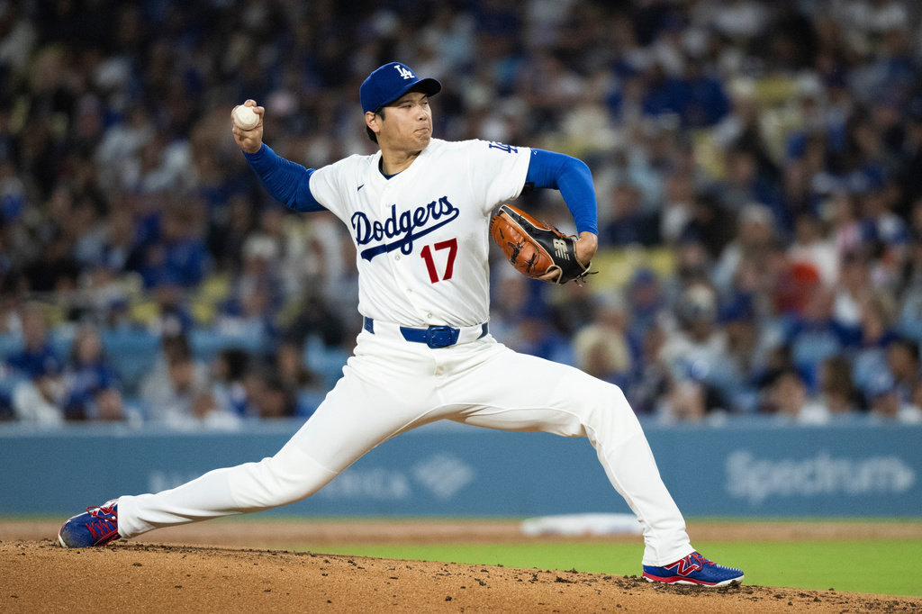 Los Angeles Dodgers starting pitcher Shohei Ohtani delivers during the second inning of a baseball game against the Cleveland Guardians in Los Angeles, Tuesday, March 31, 2026. (AP Photo/Kyusung Gong)