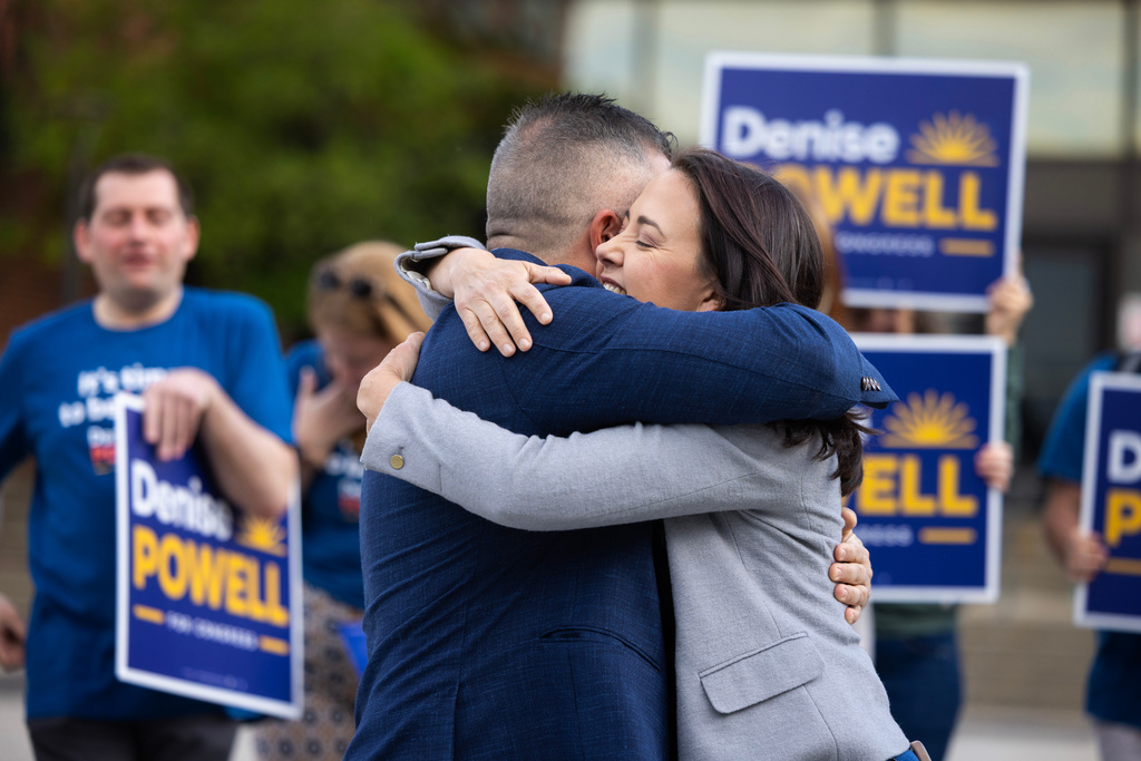Denise Powell hugs her husband, Hobson, after voting in the Nebraska Primary Election at Omaha Community Playhouse Tuesday, May 12, 2026, in Omaha, Neb. Powell is a candidate for the Democratic nomination to the House of Representatives in Nebraska's second district. (AP Photo/Rebecca S. Gratz)
