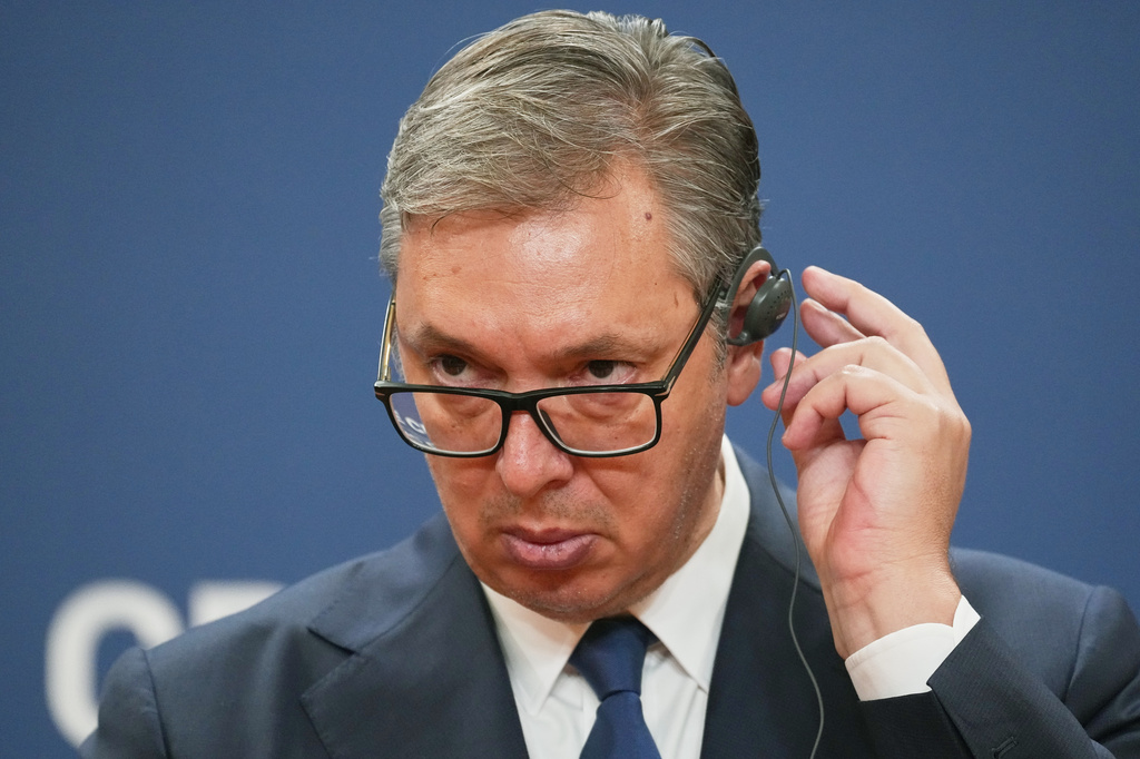 Serbian President Aleksandar Vucic adjusts his headphones during a press conference with Ukraine's President Volodymyr Zelenskyy at the Serbia Palace, in Belgrade, Serbia, Saturday, Aug. 8, 2026. (AP Photo/Darko Vojinovic)