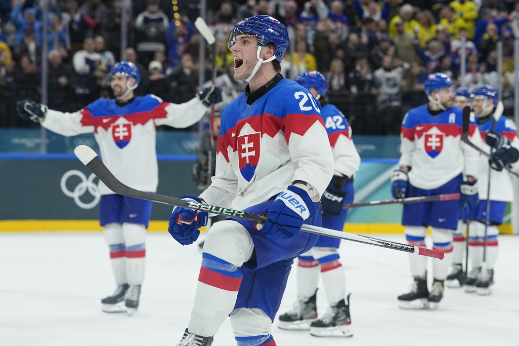 Slovakia's Juraj Slafkovsky celebrates end of a preliminary round match of men's ice hockey between Sweden and Slovakia at the 2026 Winter Olympics, in Milan, Italy, Saturday, Feb. 14, 2026. (AP Photo/Petr David Josek)