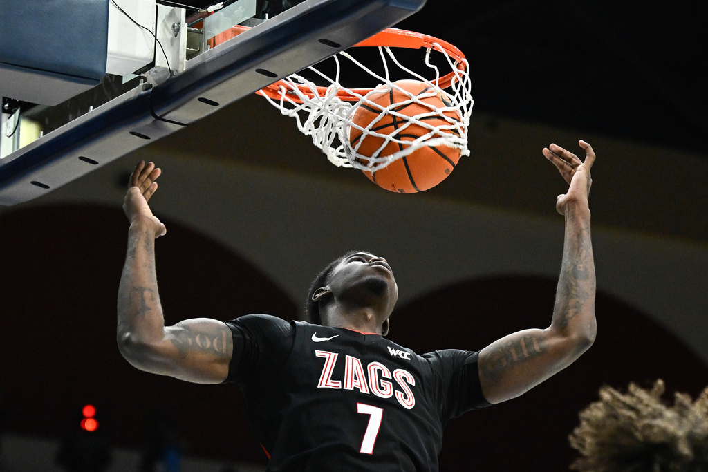 Gonzaga guard Tyon Grant-Foster (7) dunks during the second half of an NCAA college basketball game against San Diego Tuesday, Dec. 30, 2025, in San Diego. (AP Photo/Denis Poroy)