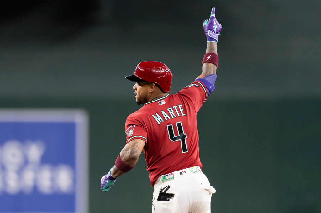 Arizona Diamondbacks' Ketel Marte (4) gestures after hitting the game-winning home run in the 10th inning of a baseball game against the Atlanta Braves, Sunday, April 5, 2026, in Phoenix. (AP Photo/Rebecca Noble)