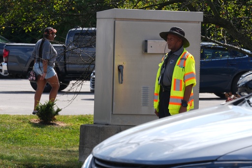 School crossing guard Anthony Taylor operates a traffic control box, Wednesday, Sept. 3, 2025, in Indianapolis. (AP Photo/Darron Cummings) School crossing guard Anthony Taylor operates a traffic control box, Wednesday, Sept. 3, 2025, in Indianapolis. (AP Photo/Darron Cummings)