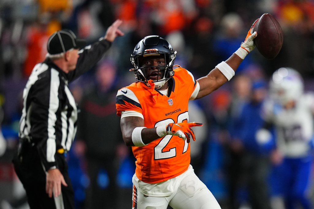 Denver Broncos cornerback Ja'quan McMillian reacts after intercepting a pass intended for Buffalo Bills wide receiver Brandin Cooks during overtime of an NFL divisional round playoff football game, Saturday, Jan. 17, 2026, in Denver. (AP Photo/Jack Dempsey)