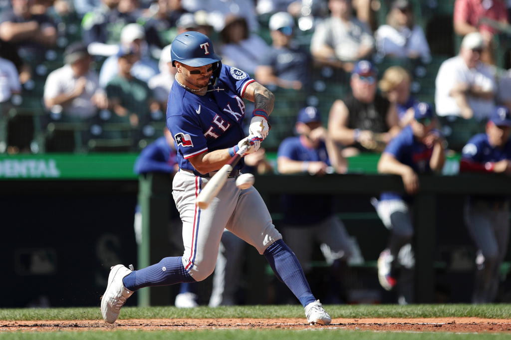 Texas Rangers Cody Freeman gets a hit off Seattle Mariners starting pitcher Kade Anderson during the fifth inning of a baseball game, Wednesday, Sept. 9, 2026, in Seattle. (AP Photo/Jason Redmond)