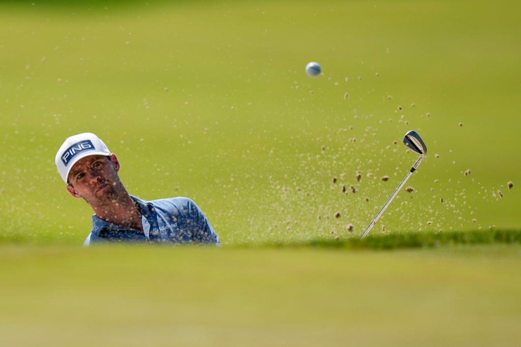 Alex Smalley hits from the bunker on the third green during the final round of the PGA Championship golf tournament at Aronimink Golf Club, Sunday, May 17, 2026, in Newtown Square, PA. (AP Photo/Frank Franklin II)